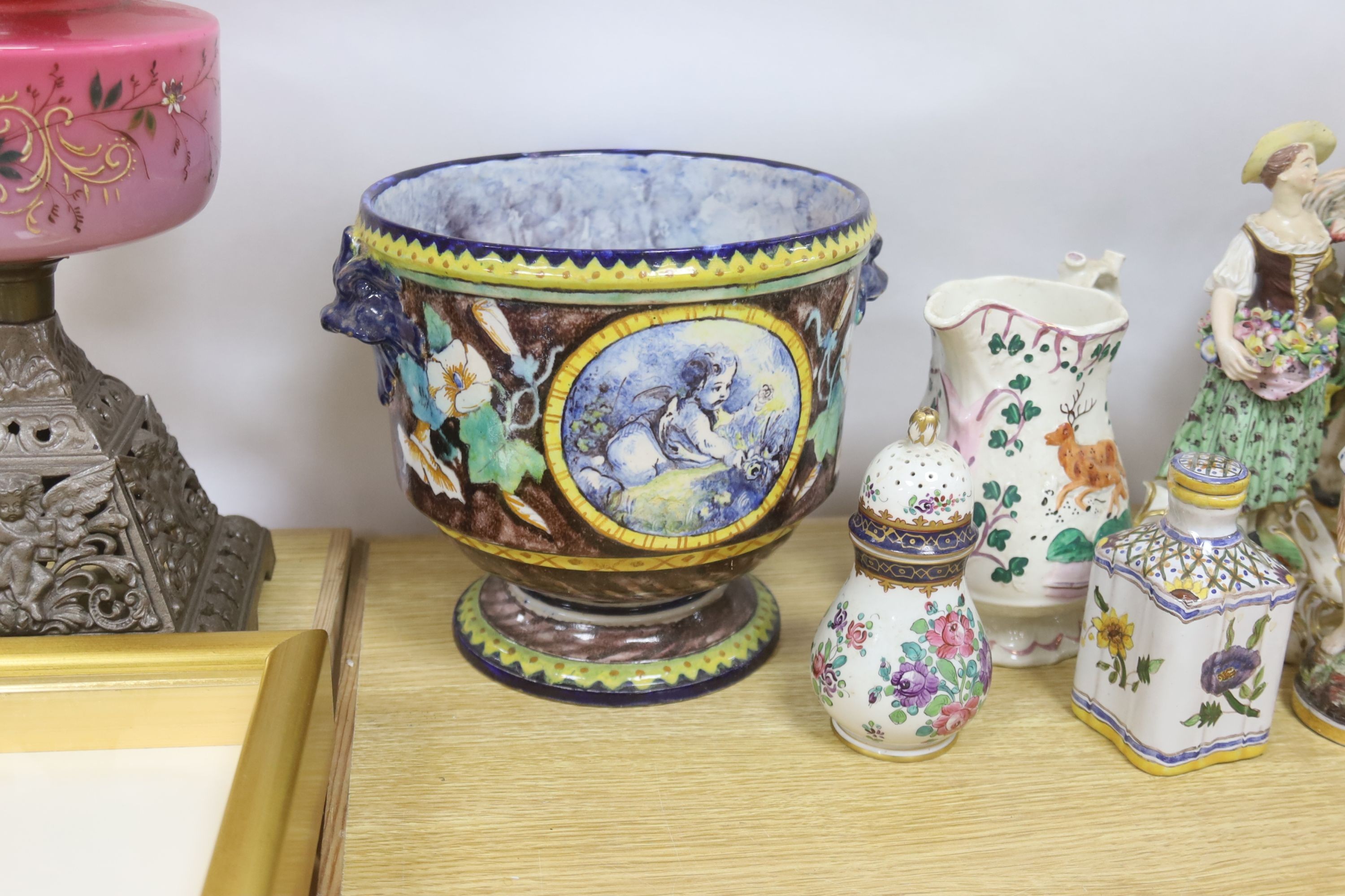 A pair of Derby candlestick figures, c.1775, 23.5 cm, a 19th century faience jardiniere or wine cooler, a Staffordshire group ‘Wolseley’ and other ceramics